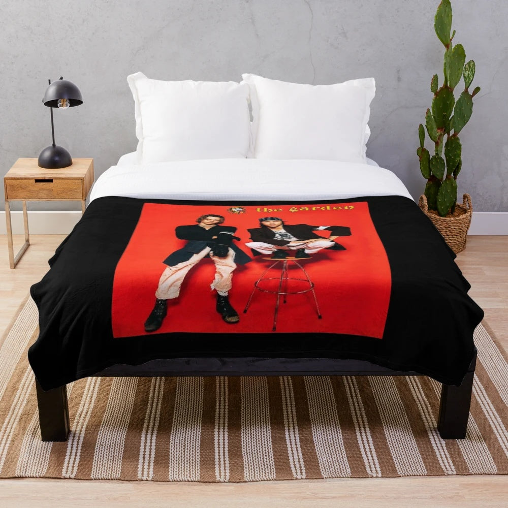 Plush holiday blanket featuring the indie band The Garden