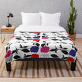 Plush blanket with the logo and members of the K-pop band The Rose