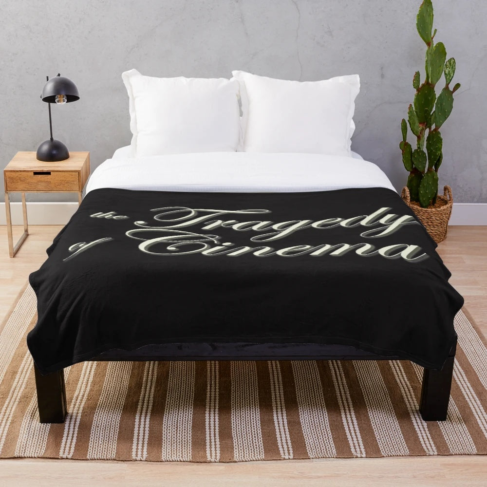 Plush blanket with The Tragedy of Cinema podcast logo design