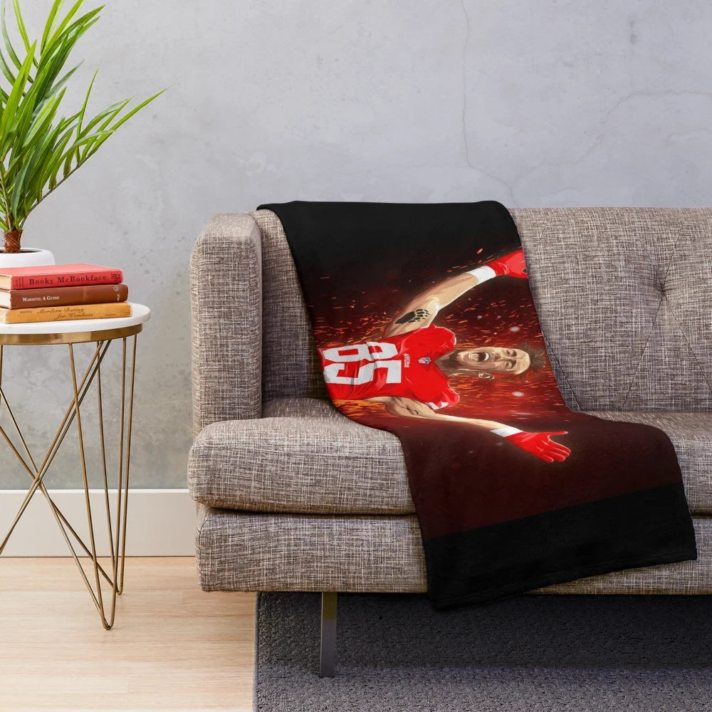 Soft and plush blanket featuring the 49ers team colors and George Kittle's jersey number