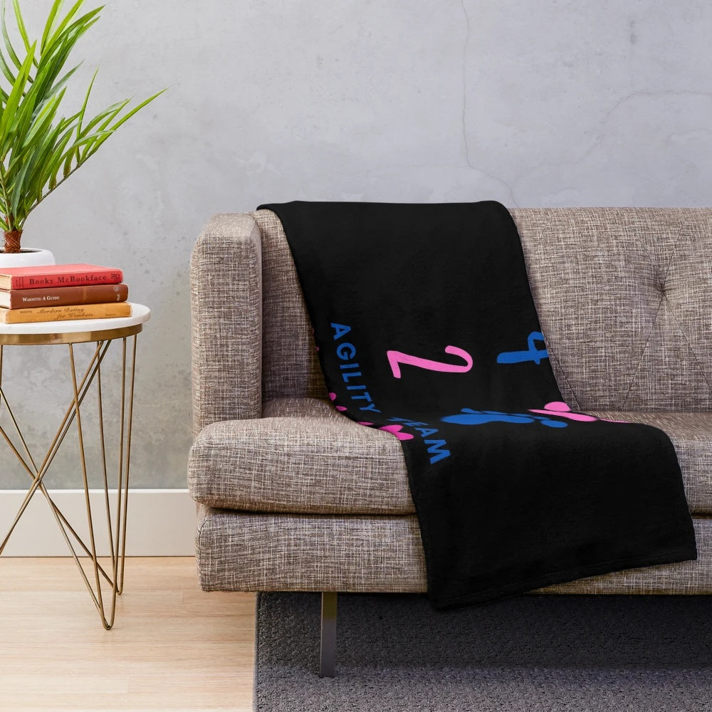 Plush blanket with hearts design, featuring agility dogs