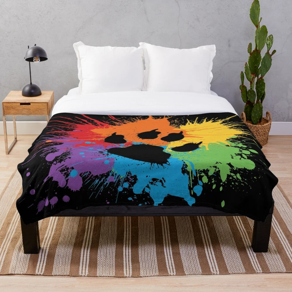 Soft, plush blanket with a cute animal print design in a rainbow color scheme