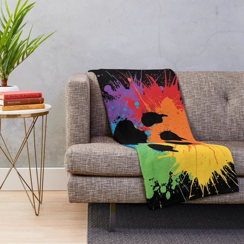Soft, plush blanket with a cute animal print design in a rainbow color scheme