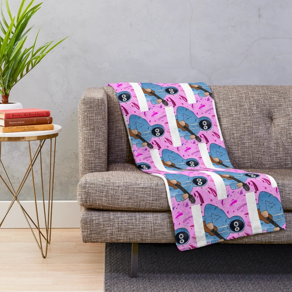 Plush blanket with an anime boy holding a ukulele design