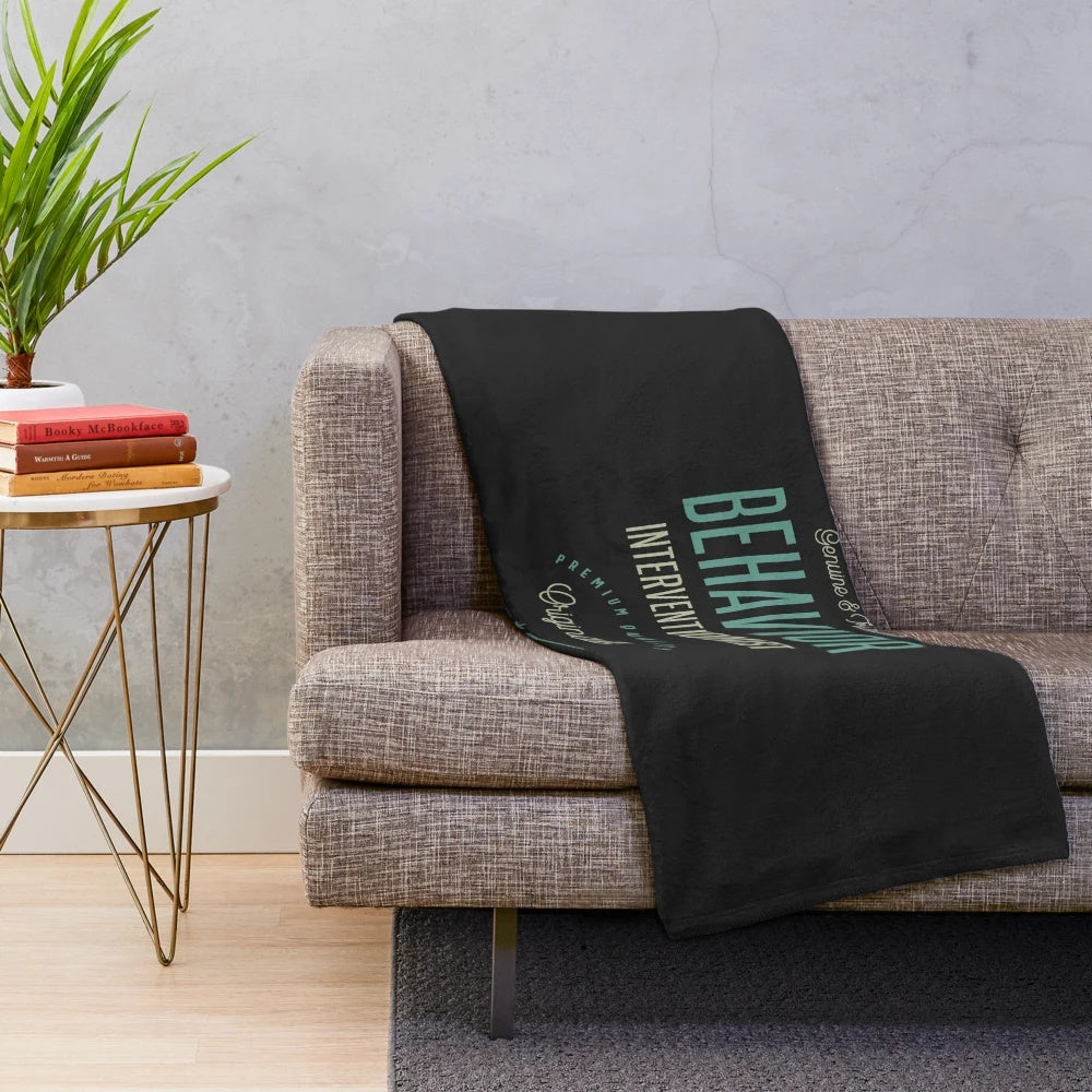 Soft and plush blanket with "Behavior Interventionist" text design