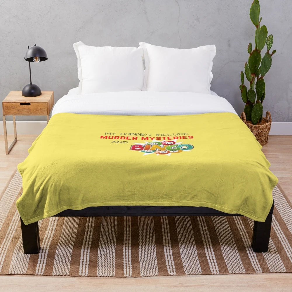 Colorful plush blanket featuring bingo balls and a murder mystery theme