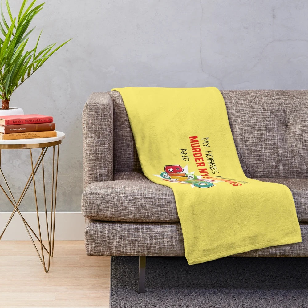 Colorful plush blanket featuring bingo balls and a murder mystery theme