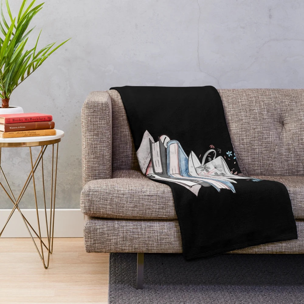 Cozy plush blanket with books and reading-themed design