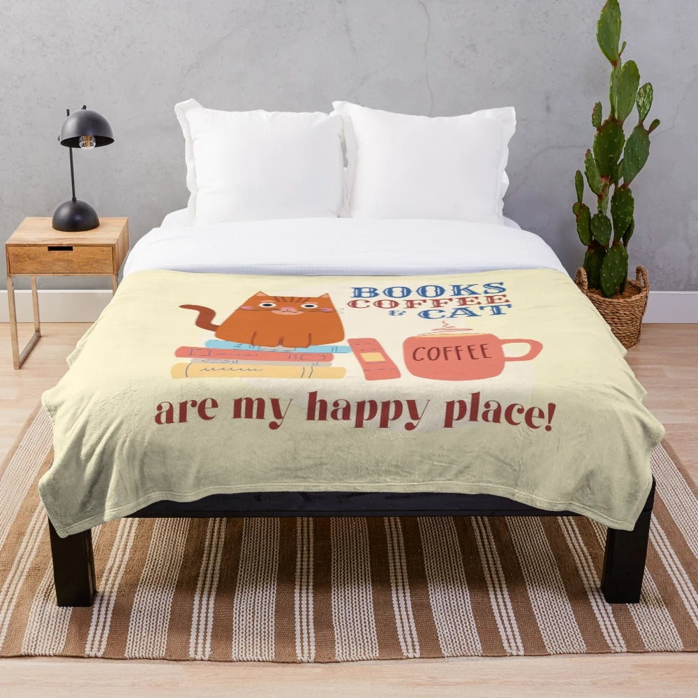 Plush blanket with books, coffee, and cat imagery