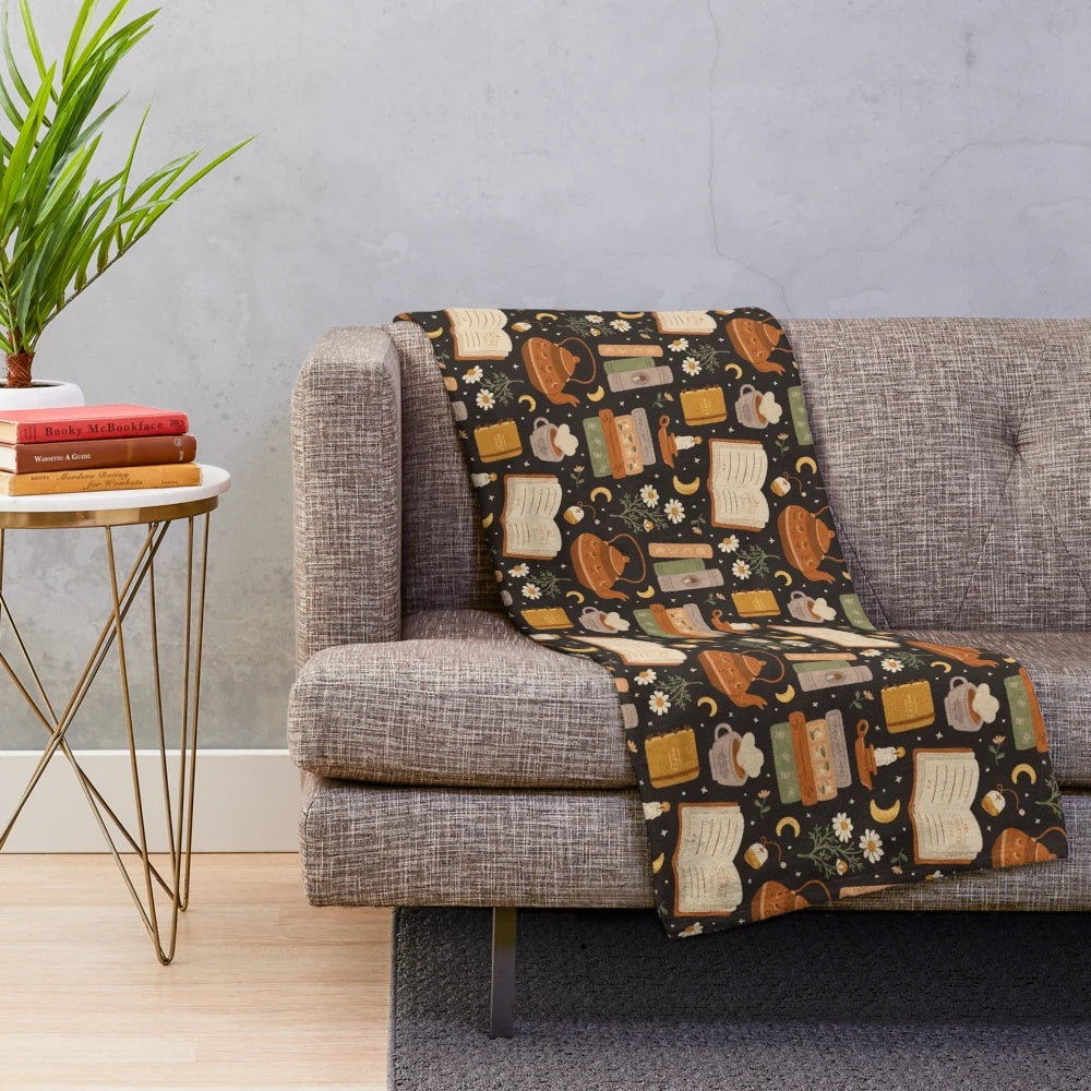 Cozy plush blanket with floral and literary patterns for book lovers