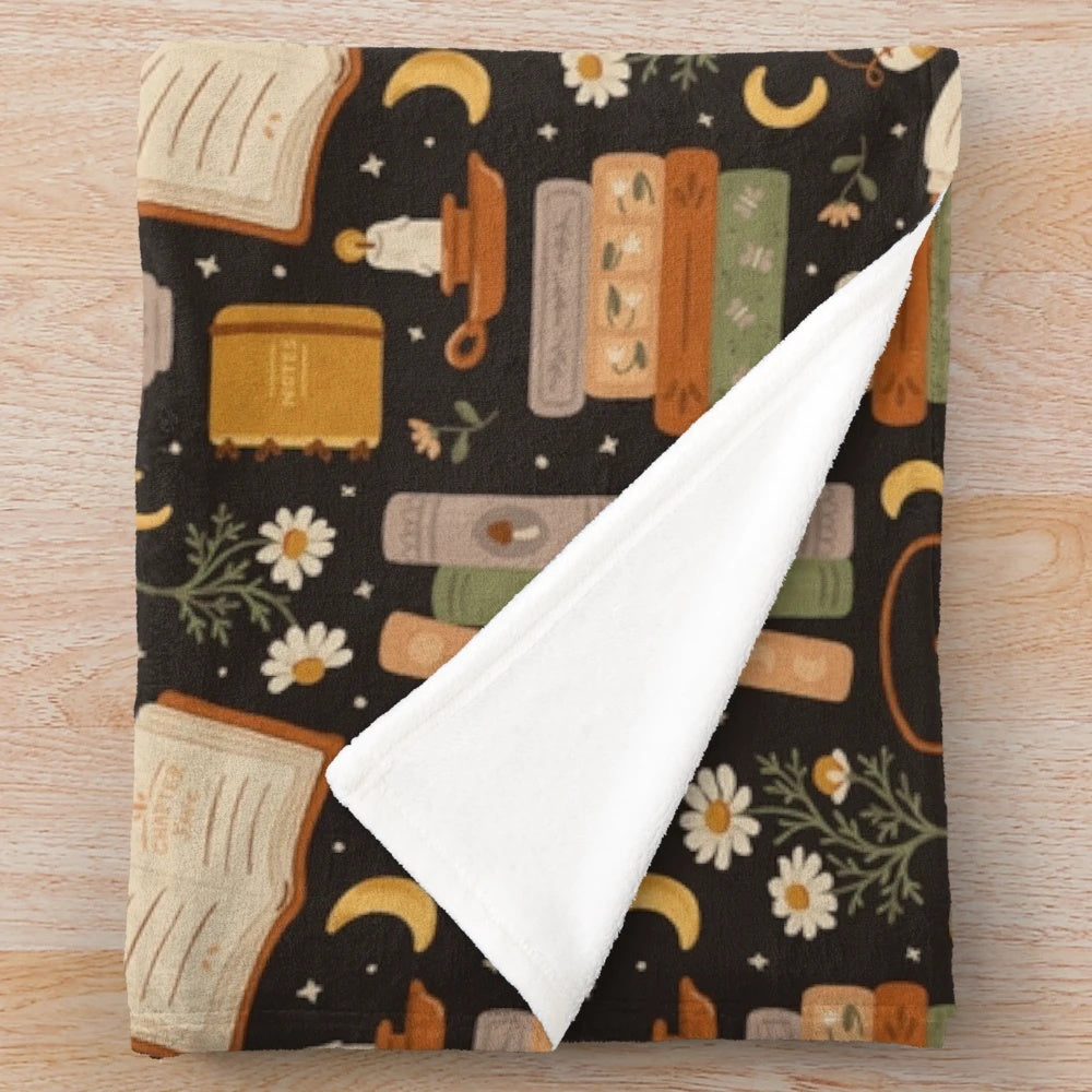 Cozy plush blanket with floral and literary patterns for book lovers