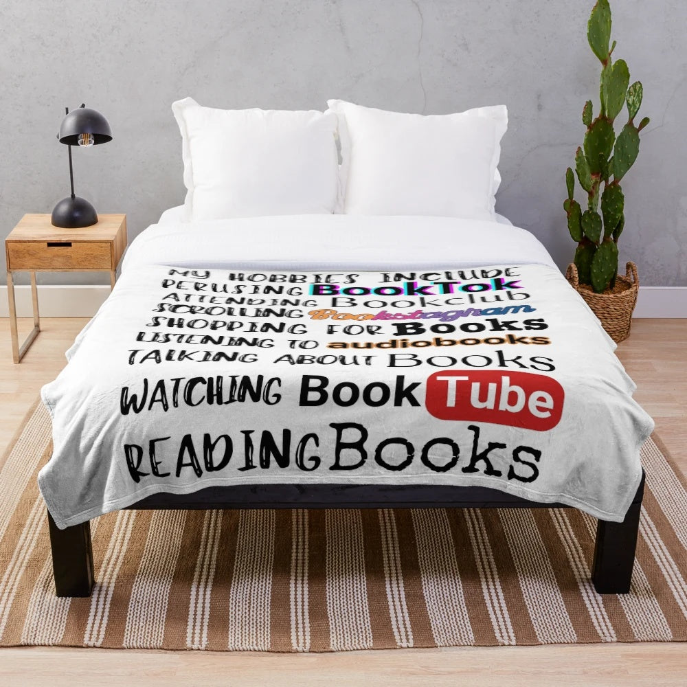 Plush blanket with a bookish design for book lovers