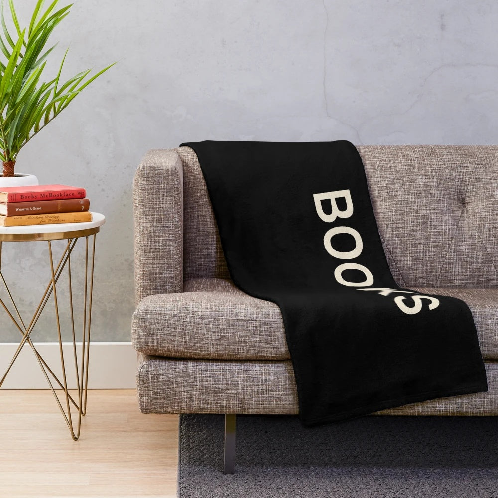 Plush blanket with books, reading, and literary-themed design