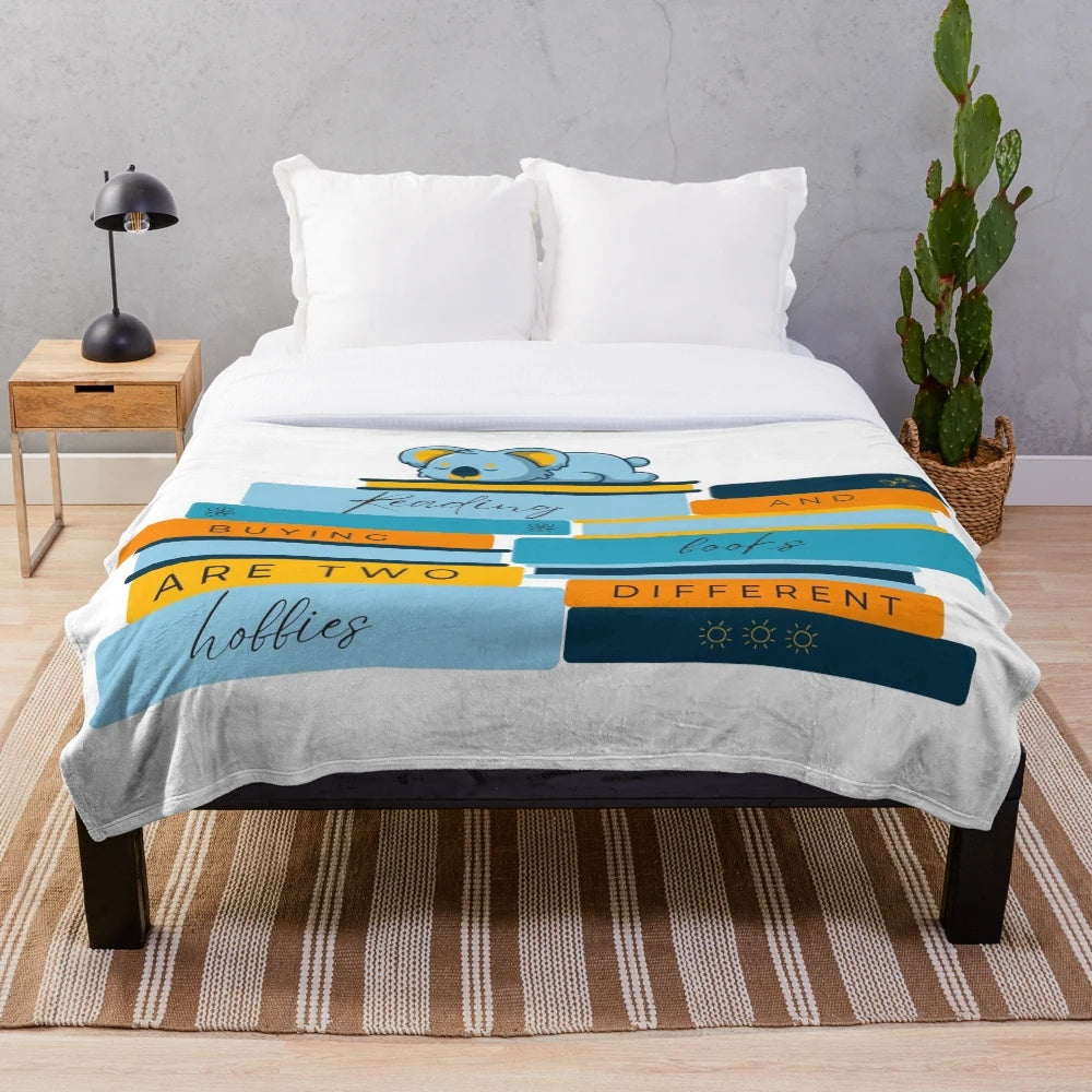 Cozy plush blanket with book and reading-themed design