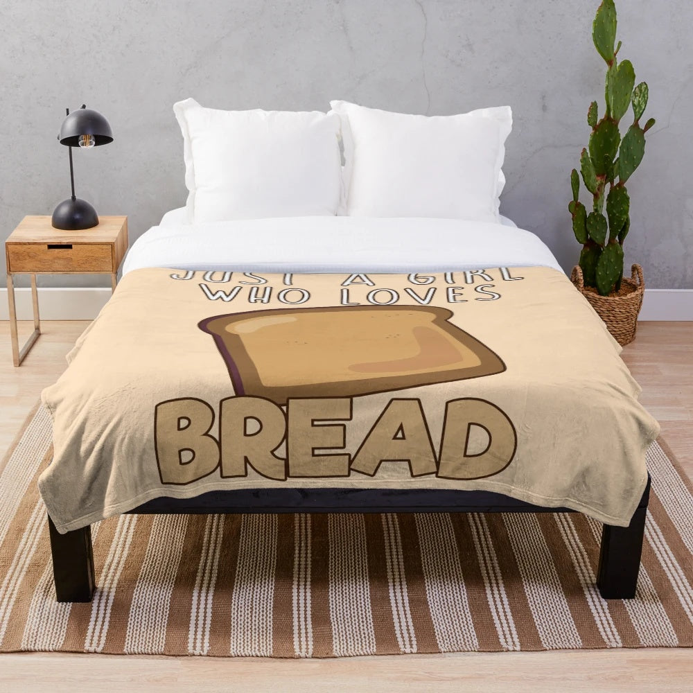 Soft and warm plush blanket with a "Just A Girl Who Loves Bread" design, perfect for bread lovers.