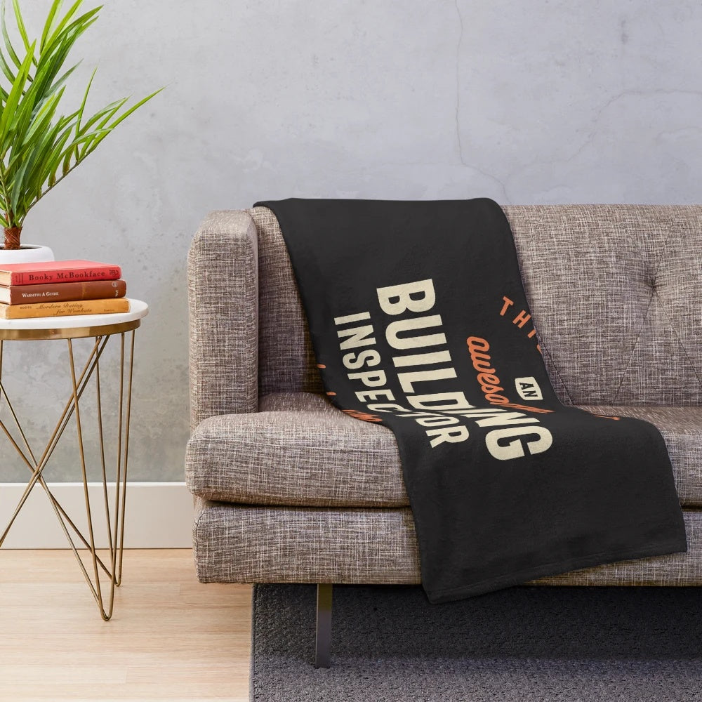 Plush blanket with building inspector design