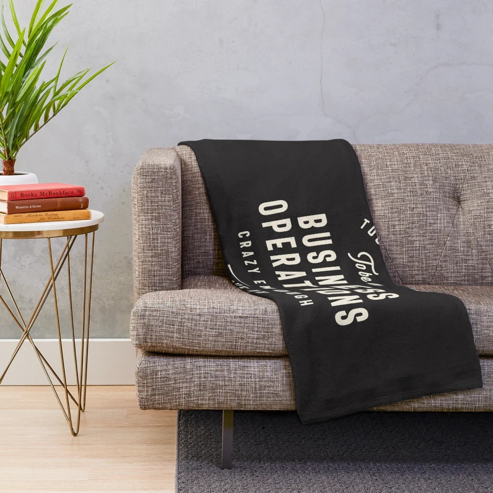 Cozy plush blanket with business operations-themed design