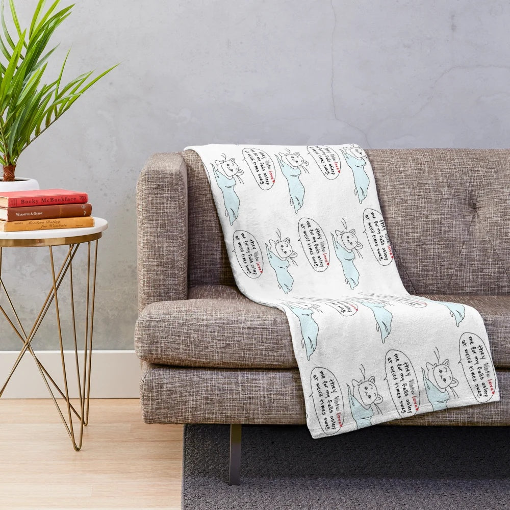 A plush, cozy blanket with a cat design, perfect for cat lovers