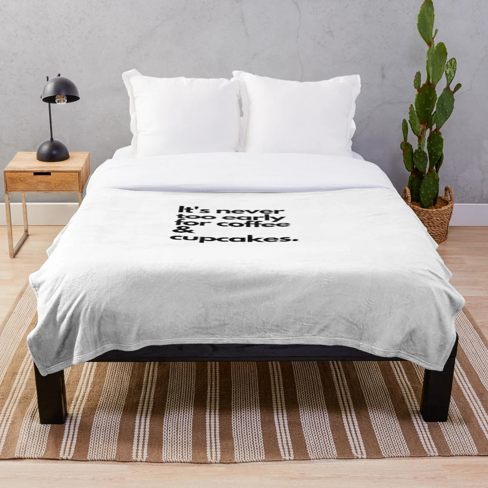 Cozy plush blanket with coffee and cupcakes design