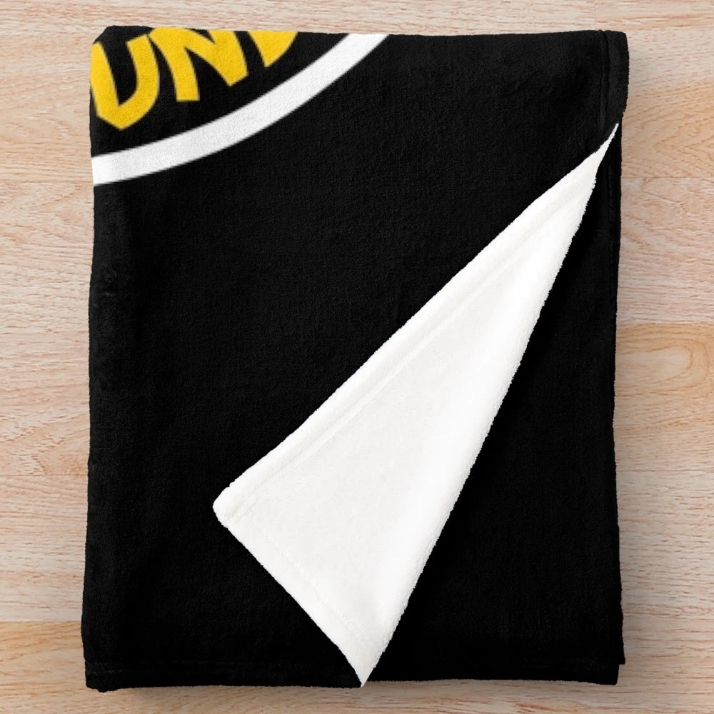 Plush blanket for coffee lovers with "Overworked, Under Caffeinated" design