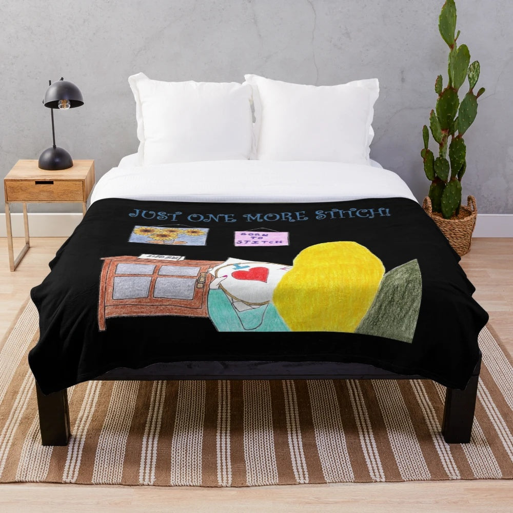 Sewing-themed plush blanket with blond and black design