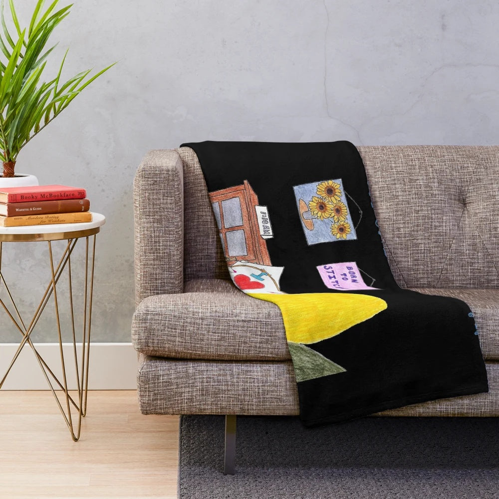 Sewing-themed plush blanket with blond and black design