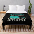 Cozy plush blanket with the text "I Crochet So I Don't Unravel