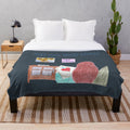 Plush blanket with sewing, stitching, and cross stitch design