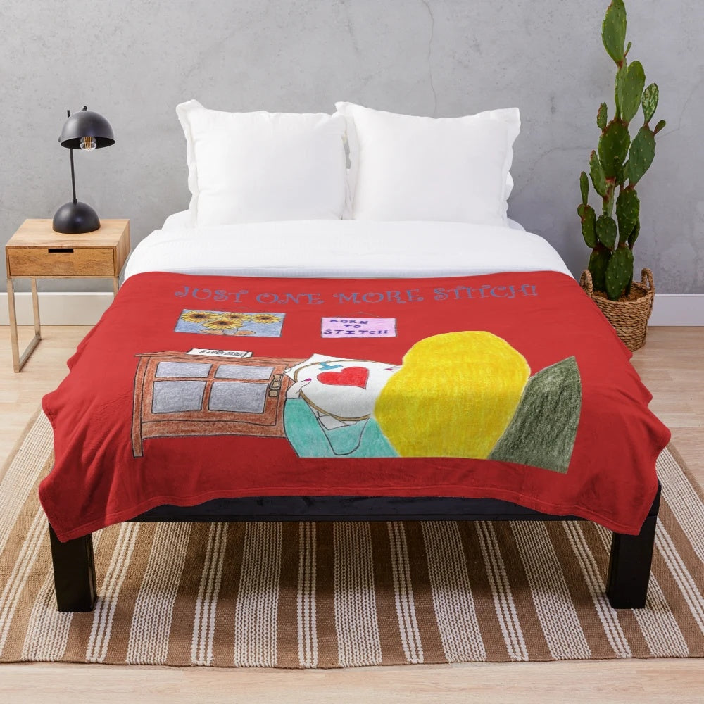 Plush blanket with sewing, stitching, and cross stitch design