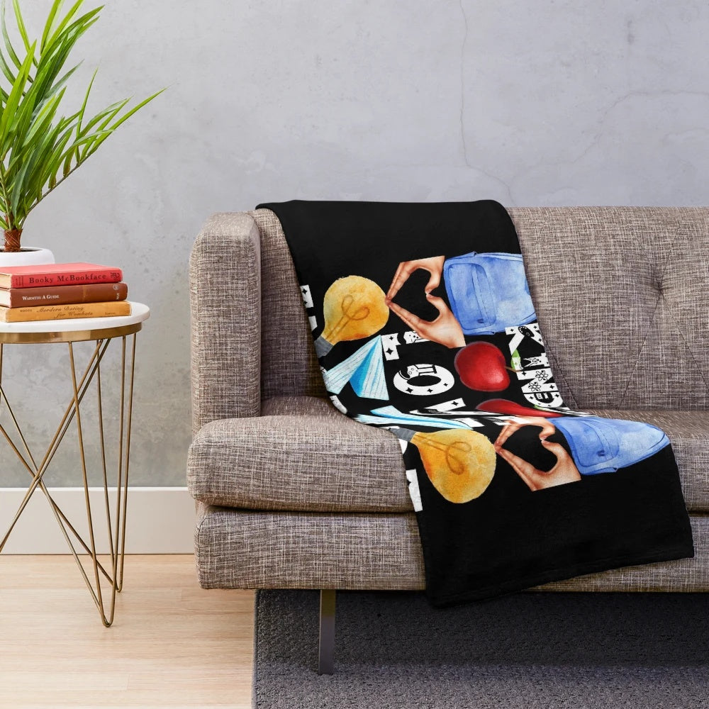 Plush blanket with inspirational teaching-themed design