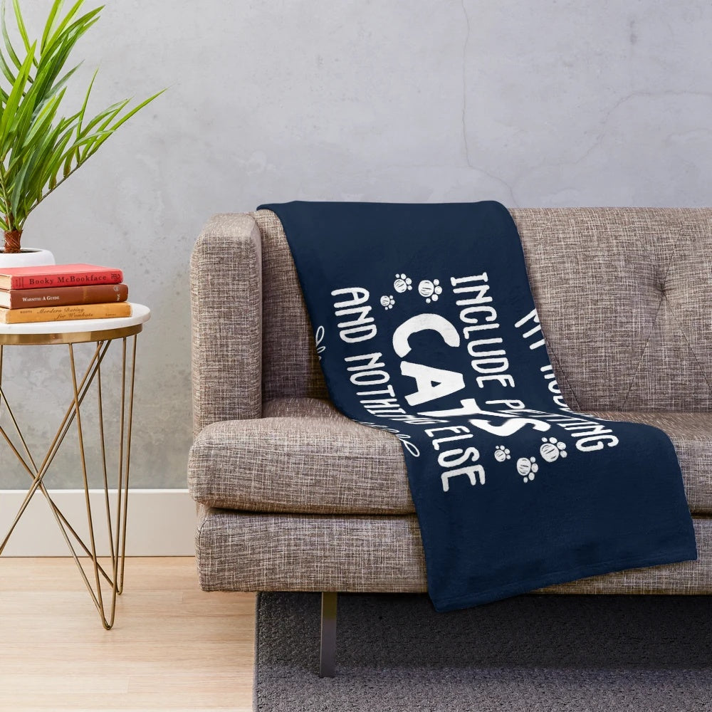 Plush blanket with the text "My hobbies include petting cats and nothing else" on a soft, cuddly design