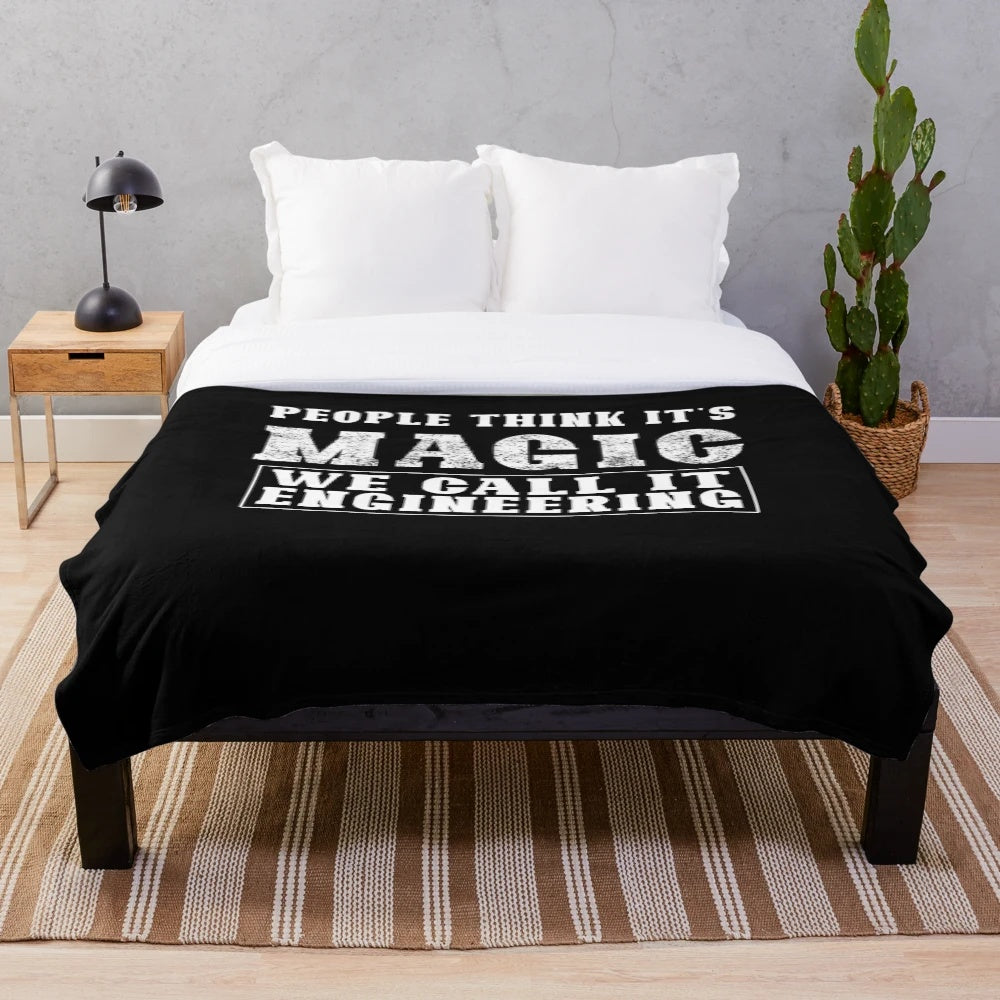 Engineering-themed plush blanket with "People Think It's Magic. We Call It Engineering" design