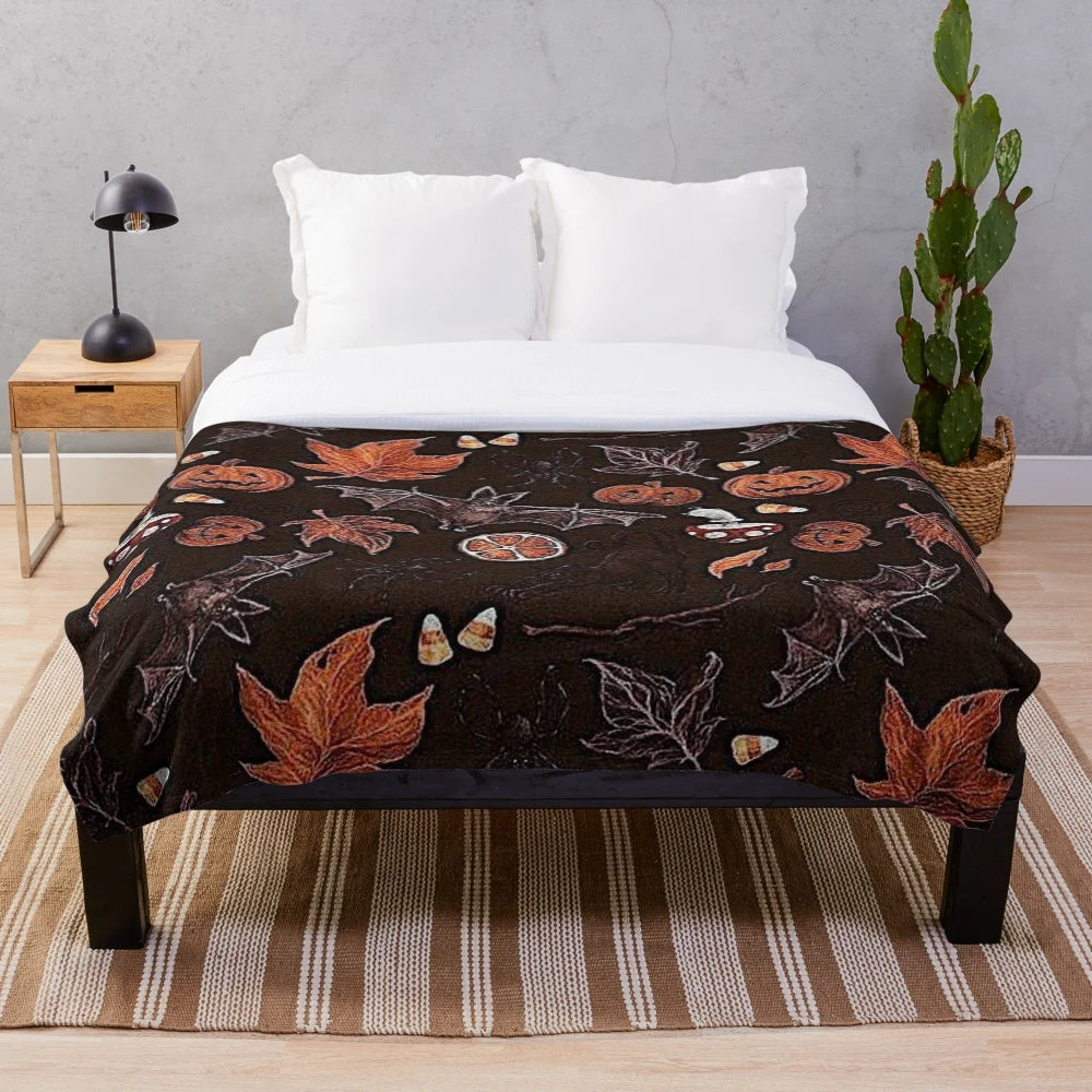 Plush blanket with autumn leaves and pumpkin pattern