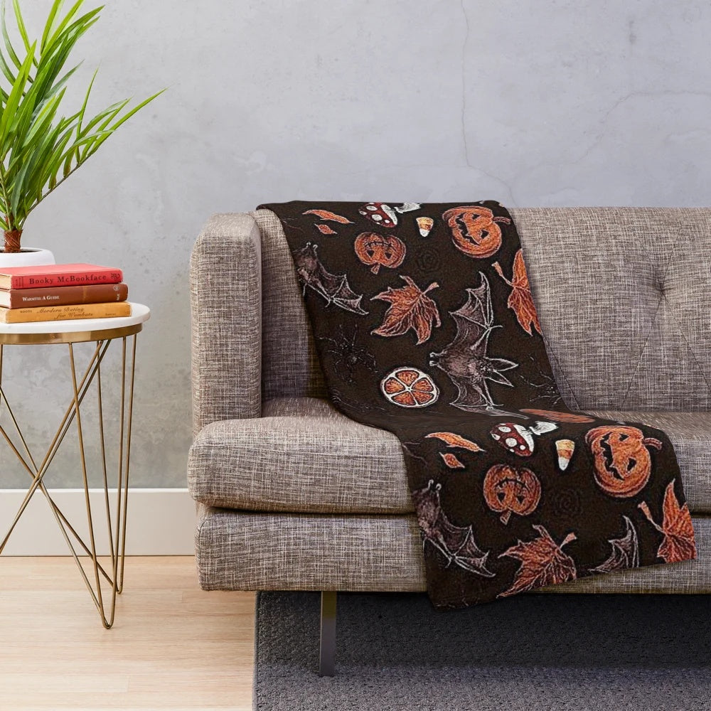 Plush blanket with autumn leaves and pumpkin pattern