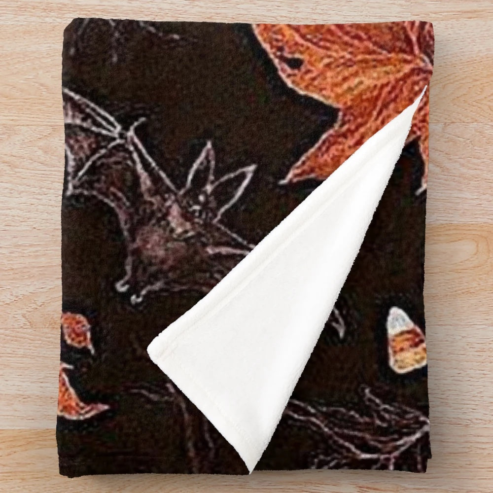 Plush blanket with autumn leaves and pumpkin pattern