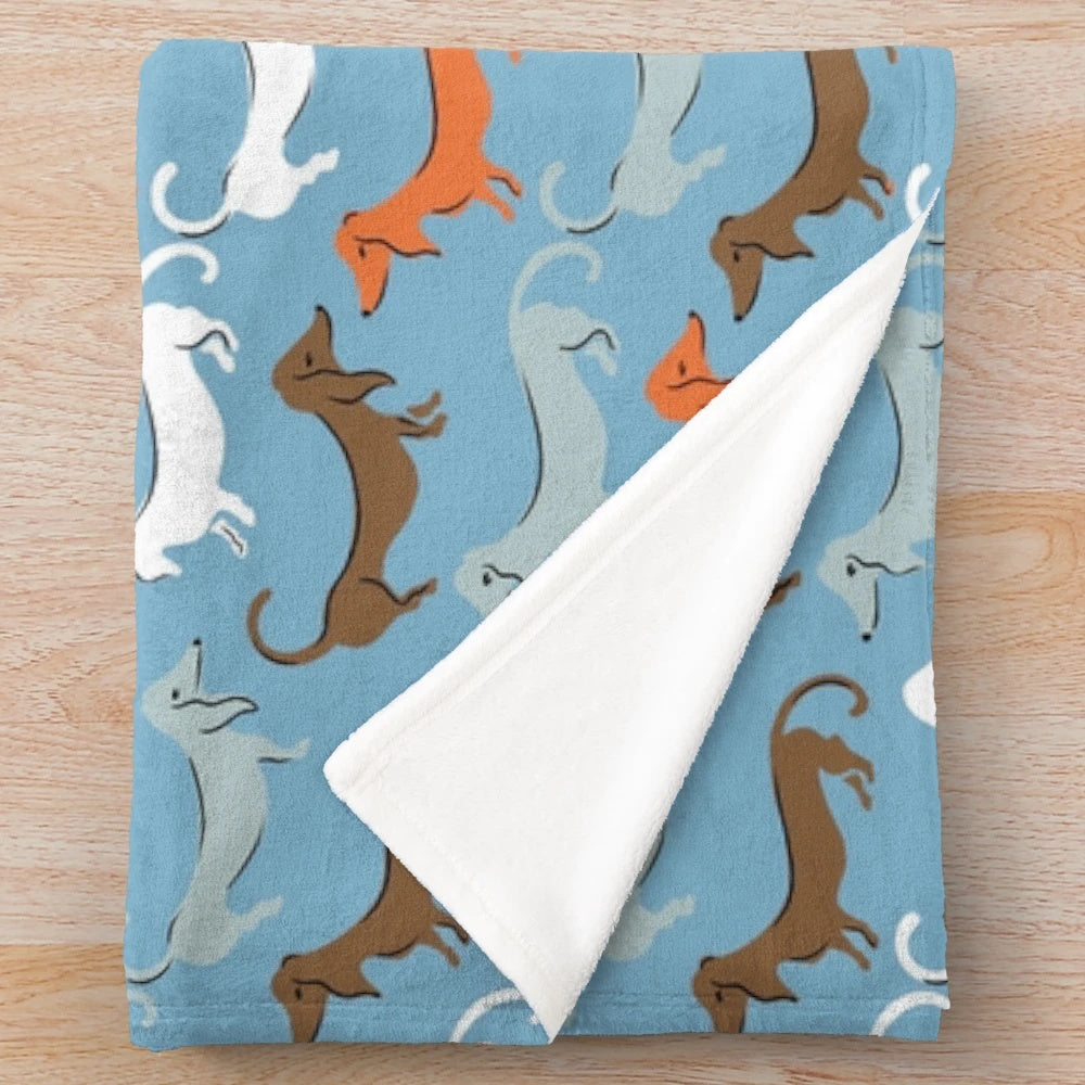 Cozy plush blanket featuring dachshund/wiener dog design for Hannibal, Nigel, and Charlie Countryman fans