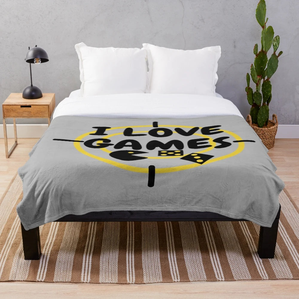 Plush blanket with a games design for gaming enthusiasts