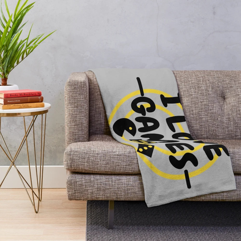 Plush blanket with a games design for gaming enthusiasts