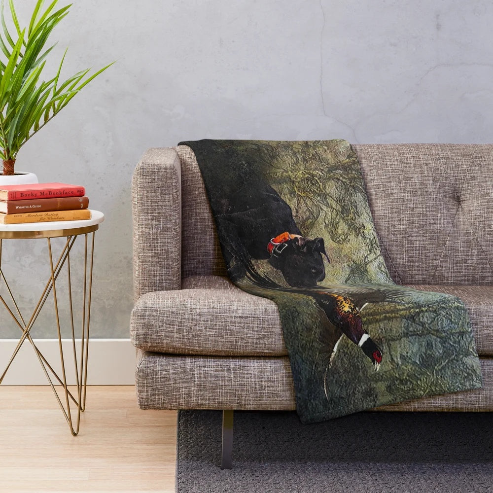 German Shorthaired Pointer (GSP) dog on a plush hunting-themed blanket