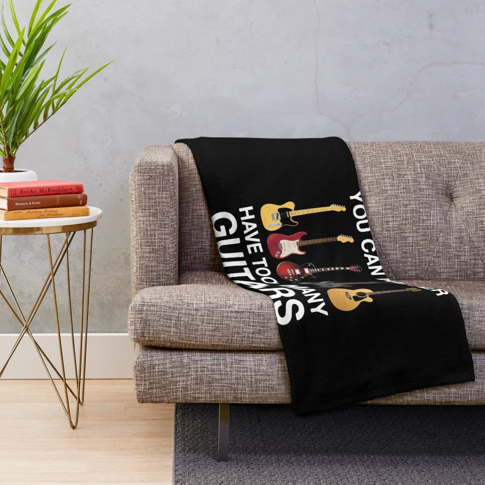 Cozy plush blanket with guitars and music-themed design