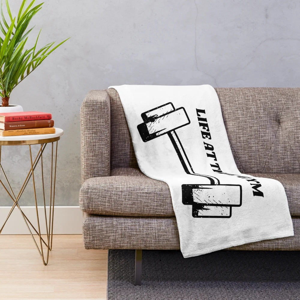 Plush blanket with gym-themed design