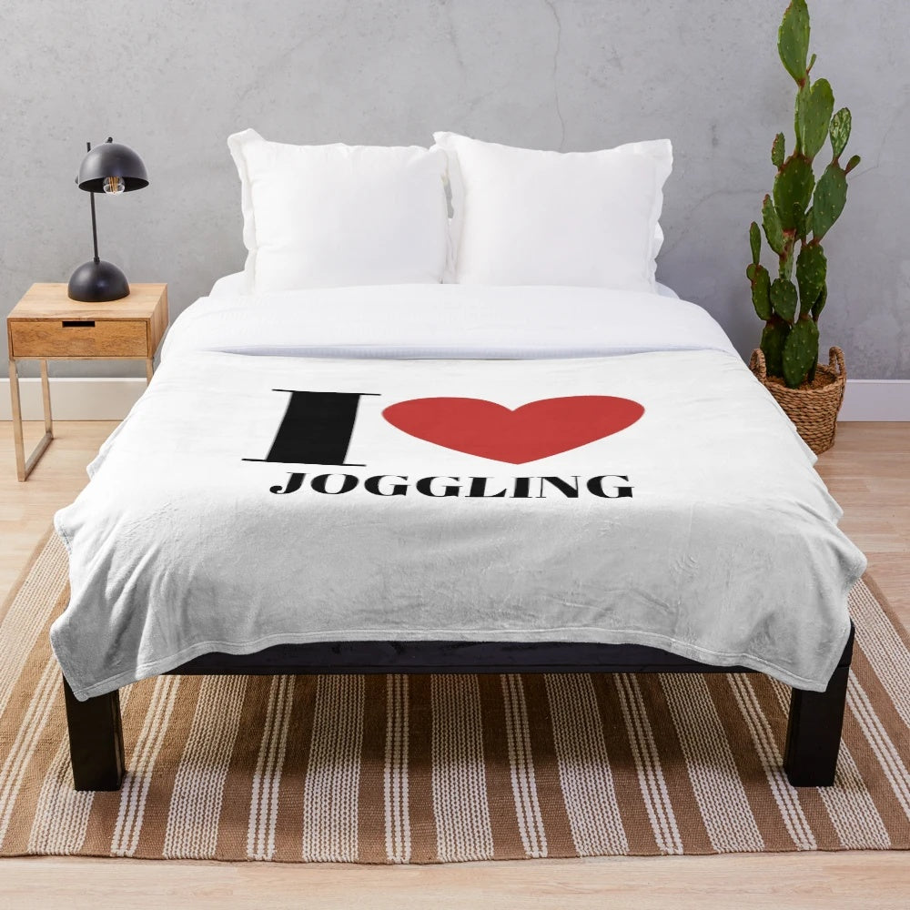 Plush blanket with joggling design