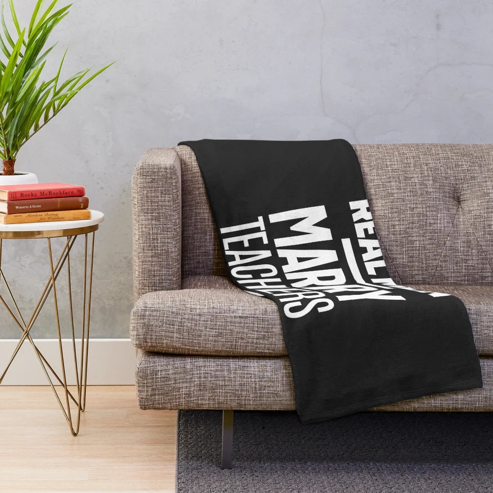 Cozy plush blanket featuring the text "Real Men Marry Teachers