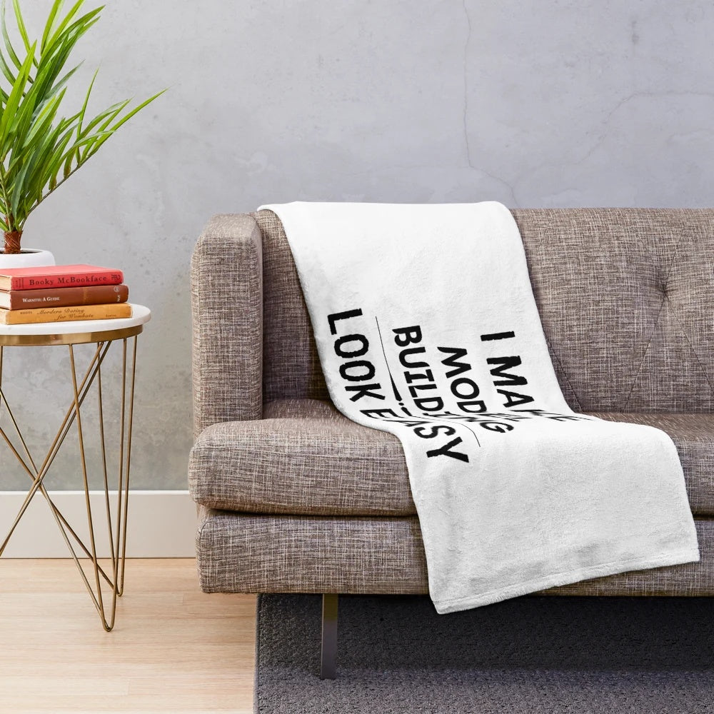 Plush blanket with "I Make Model Building Look Easy" text and model building icons