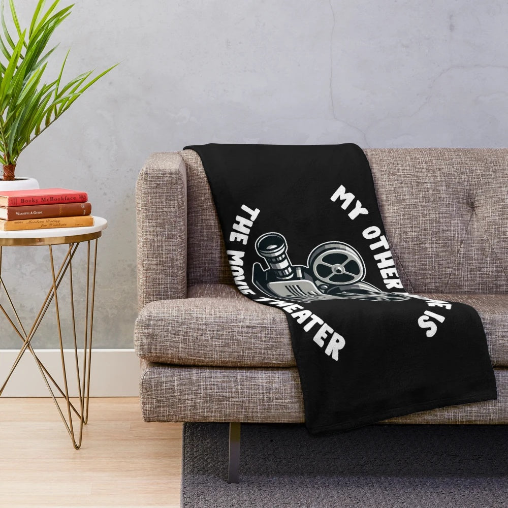 Plush blanket with movie critic, film, and cinema design