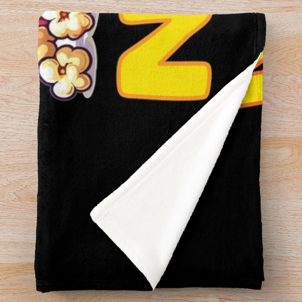 Plush blanket with movie night, popcorn, and lemonade design