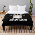 Plush blanket with popcorn design for movie enthusiasts