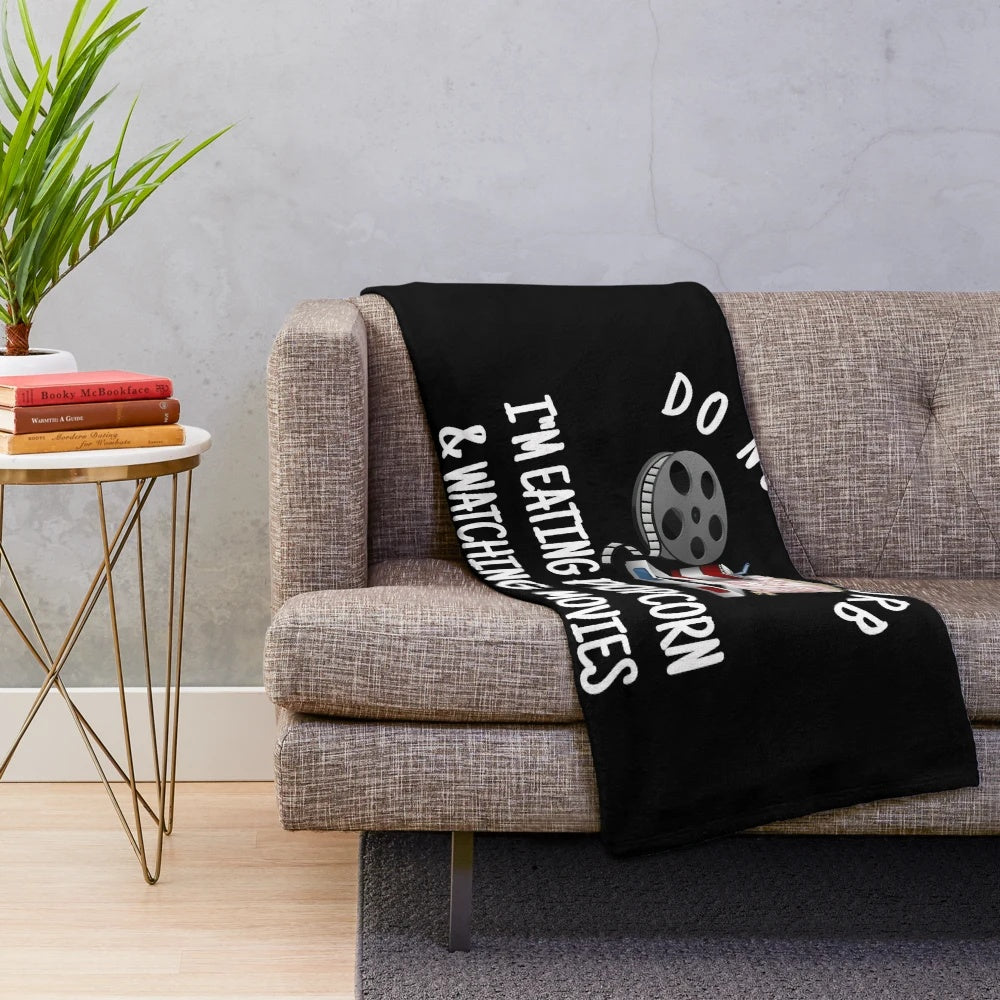 Plush blanket with popcorn and movie night design