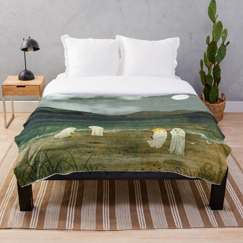 Plush blanket with coastal landscape design