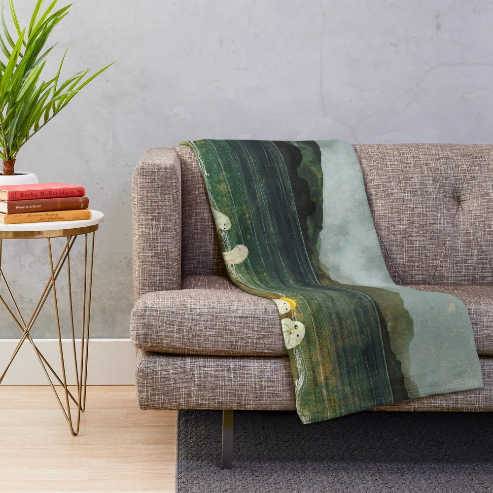 Plush blanket with coastal landscape design